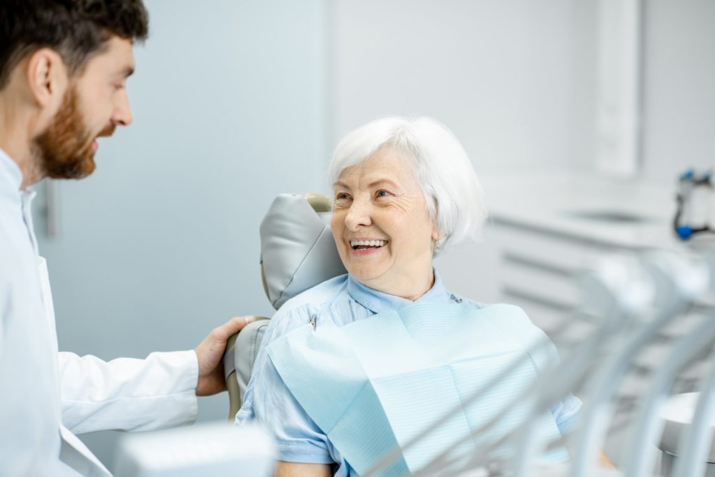 Elder woman during the consultation with dentist